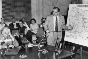 The Army-McCarthy hearings, 1954. McCarthy stands at right; Joseph Welch, opposing counsel, seated, left. (Courtesy U. S. Senate Historical Office)